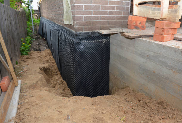Happy homeowners after waterproofing job in Blue Rock
